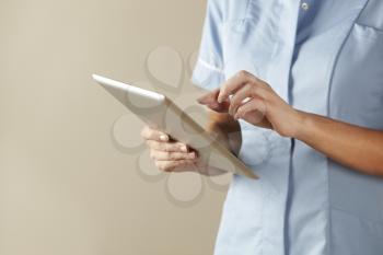 UK nurse using computer tablet