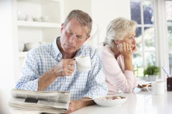 Retired couple eating breakfast