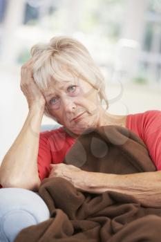 Sick, unhappy older woman at home