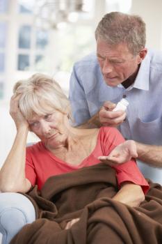 Senior man looking after sick wife
