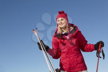 Middle Aged Woman On Ski Holiday In Mountains