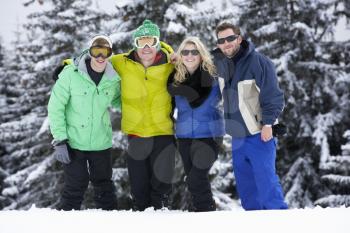 Group Of Young Friends On Ski Holiday In Mountains