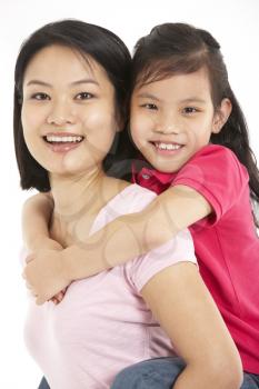 Studio Shot Of Chinese Mother And Daughter