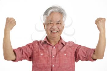 Studio Shot Of Jubilant Chinese Senior Man