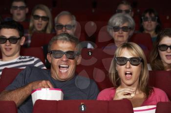 Couple Watching 3D Film In Cinema