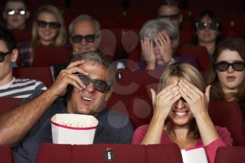 Couple Watching 3D Film In Cinema