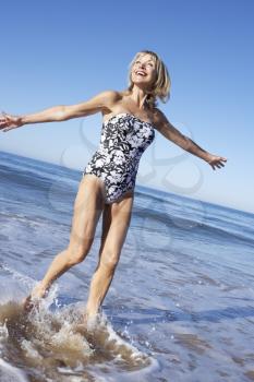 Senior Woman Enjoying Beach Holiday