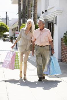 Senior Couple Carrying Shopping Bags