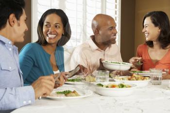 Group Of Friends Enjoying Meal At Home