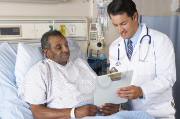 Doctor Explaining Consent Form To Senior Patient
