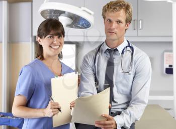 Portrait Of Doctor And Nurse In Doctor's Office