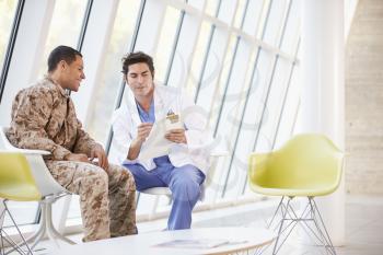 Doctor Counselling Soldier Suffering From Stress