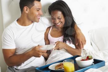 Man Bringing Woman Breakfast In Bed On Celebration Day