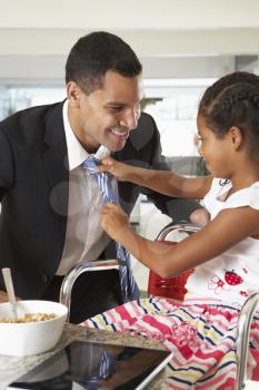 Daughter Straightens Father's Tie Before He Leaves For Work