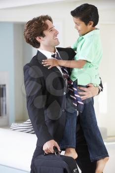 Son Greets Father On Return From Work