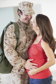 Pregnant Wife Greeting Military Mother Home On Leave
