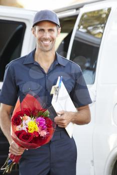 Portrait Of Delivery Driver With Flowers
