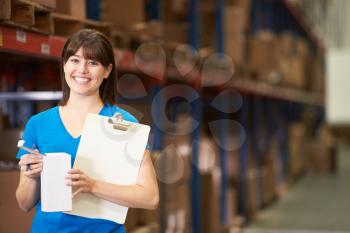 Female Worker In Distribution Warehouse