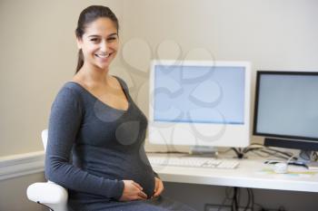 Portrait Of Pregnant Office Worker