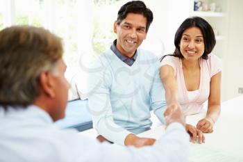 Indian Couple Meeting With Financial Advisor At Home