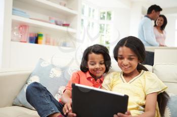 Indian Family With Digital Tablet At Home