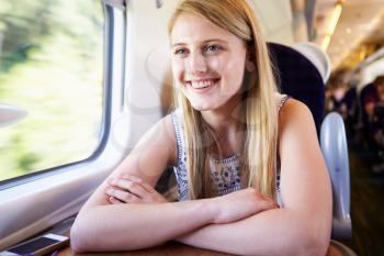 Teenage Girl Relaxing On Train Journey