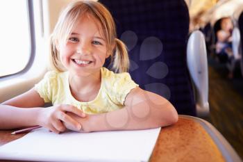 Girl Drawing Picture On Train Journey