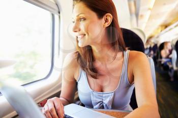 Woman Using Laptop On Train