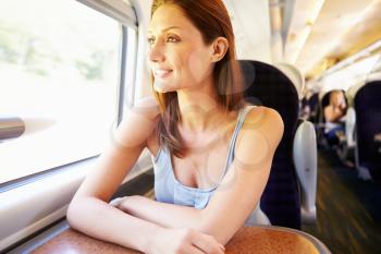 Woman Relaxing On Train Journey
