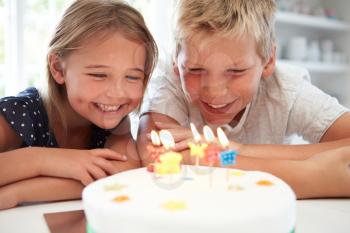 Children Celebrating Birthday With Cake