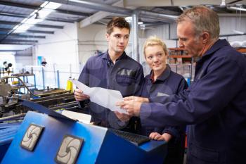 Engineer Teaching Apprentices To Use Tube Bending Machine