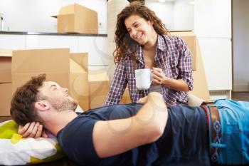 Couple Taking A Break During House Move