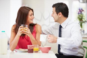 Couple Having Breakfast Before Husband Goes To Work