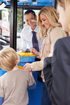 Mother And Son Boarding Bus And Buying Ticket