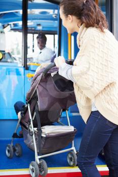 Mother With Child In Pushchair Boarding Bus
