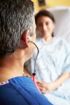 Close Up Of Male Doctor Using Stethoscope