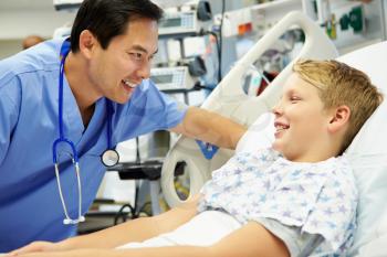 Boy Talking To Male Nurse In Emergency Room