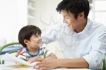 Father Helping Son With Homework