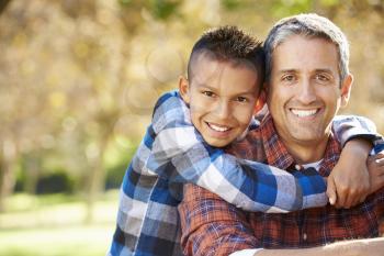 Portrait Of Father And Son In Countryside