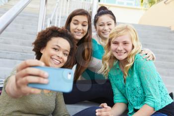 Female High School Students Taking Selfie Photograph
