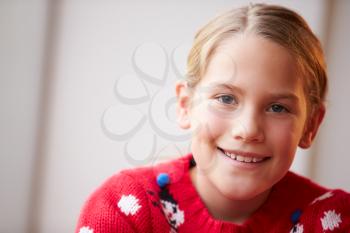 Portrait Of Girl Wearing Christmas Jumper