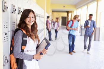 Female High School Student Standing By Lockers