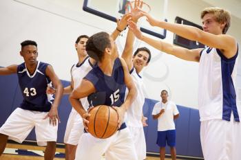 Male High School Basketball Team Playing Game