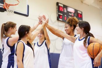 Female High School Basketball Team Having Team Talk