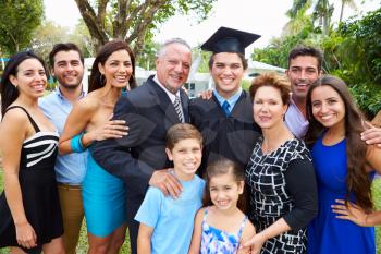 Hispanic Student And Family Celebrating Graduation