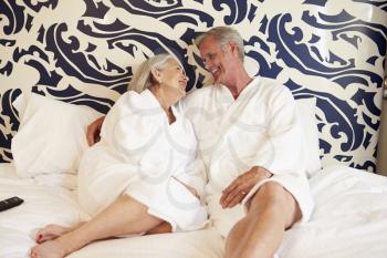 Senior Couple Relaxing In Hotel Room