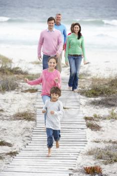 Family walking by the sea