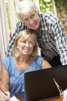 Senior Couple Working In Home Office
