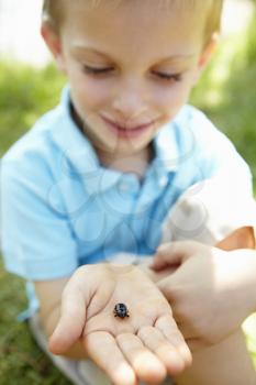 Young boy with beetle
