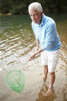 Senior man with fishing net